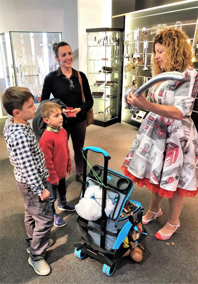 Olivia making sword balloons at Yamaha Music London store in Soho