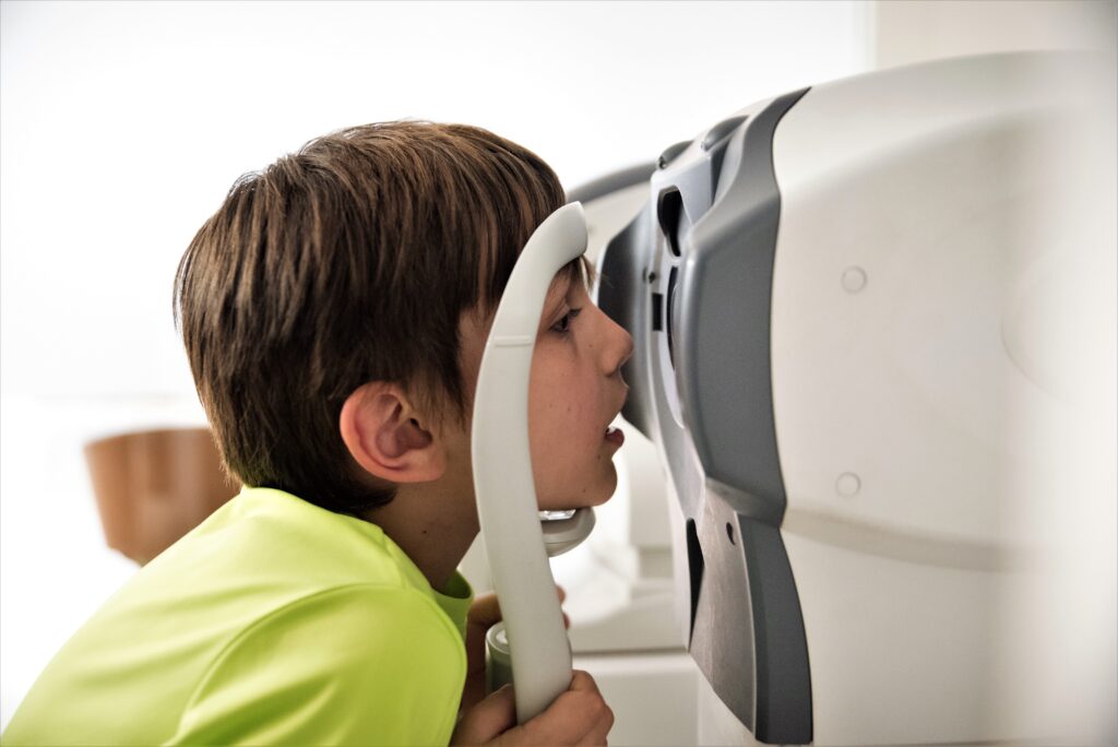 Taking an eye test - child's first eye test - child and family eyecare