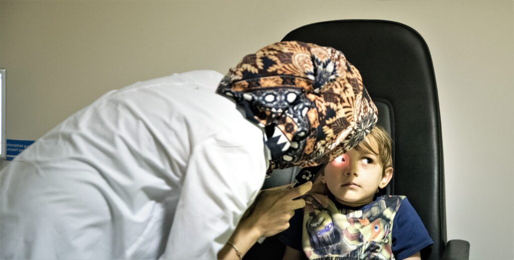 Taking an eye test - child's first eye test