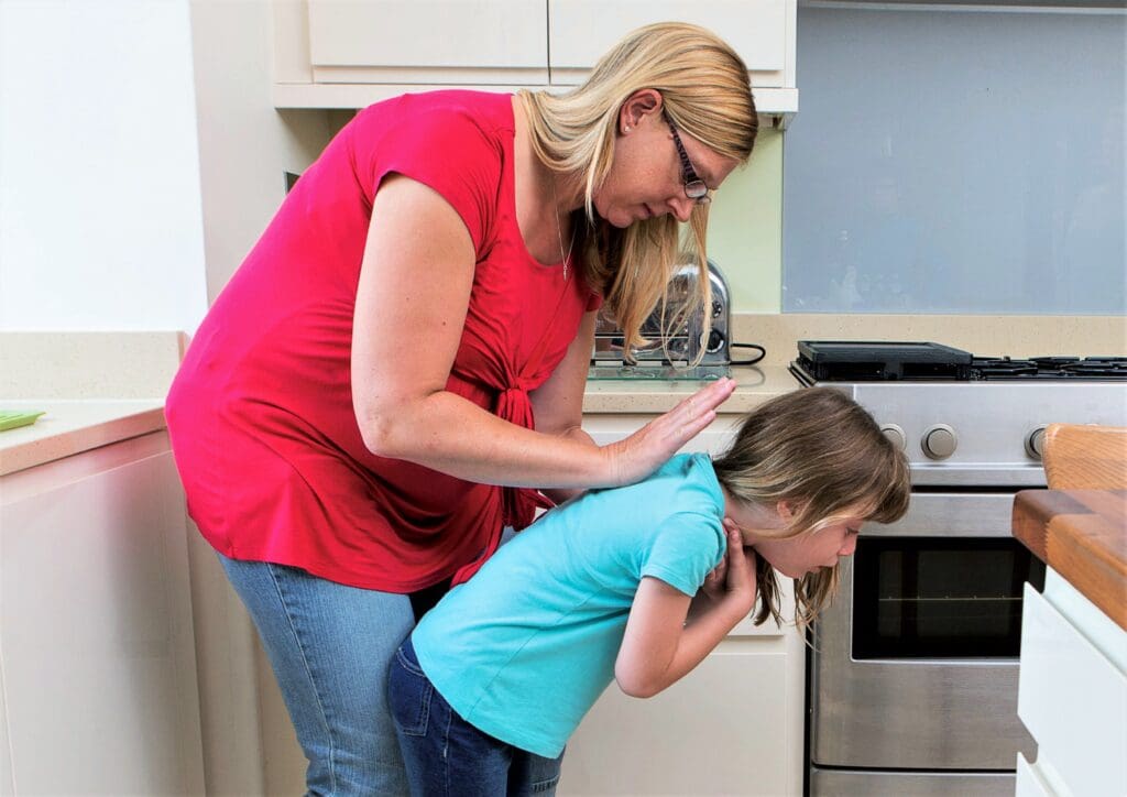 Step 1 - Give up to five back blows
Hit them firmly on their back between the shoulder blades. If back blows do not dislodge the object, move onto Step 2