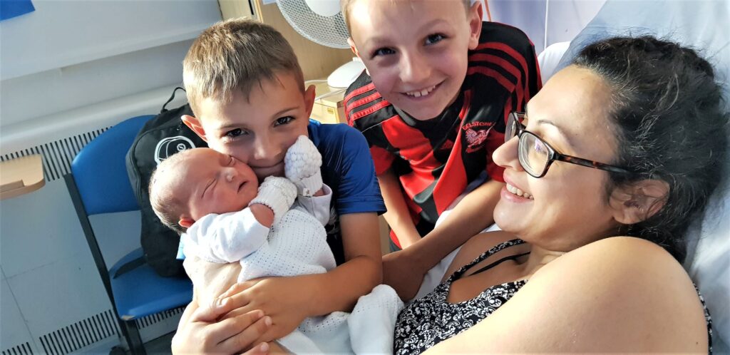 Family photo with the new addition