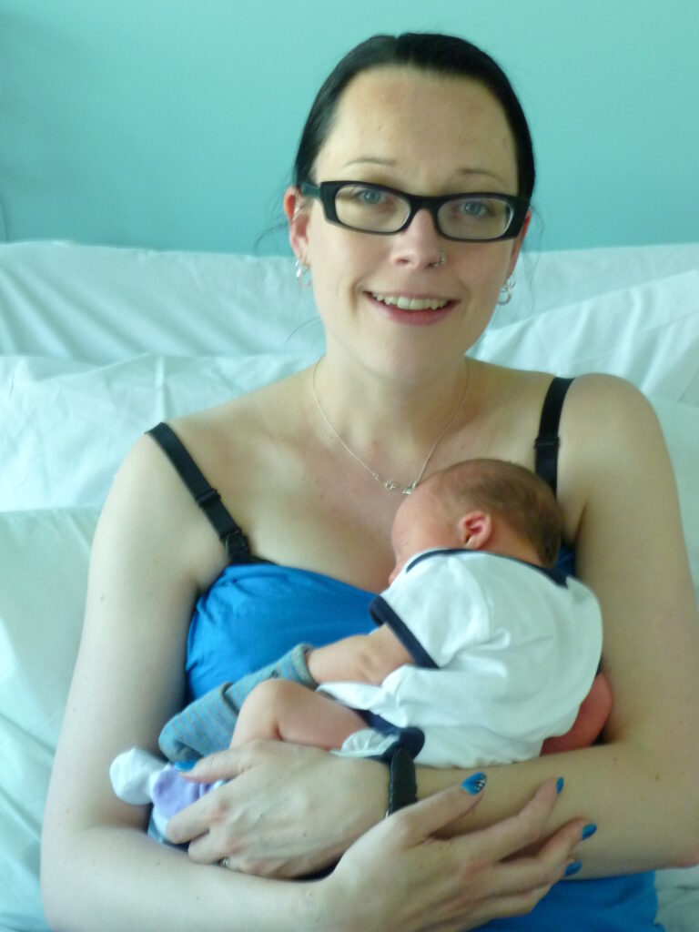 Clare Doble holding her baby