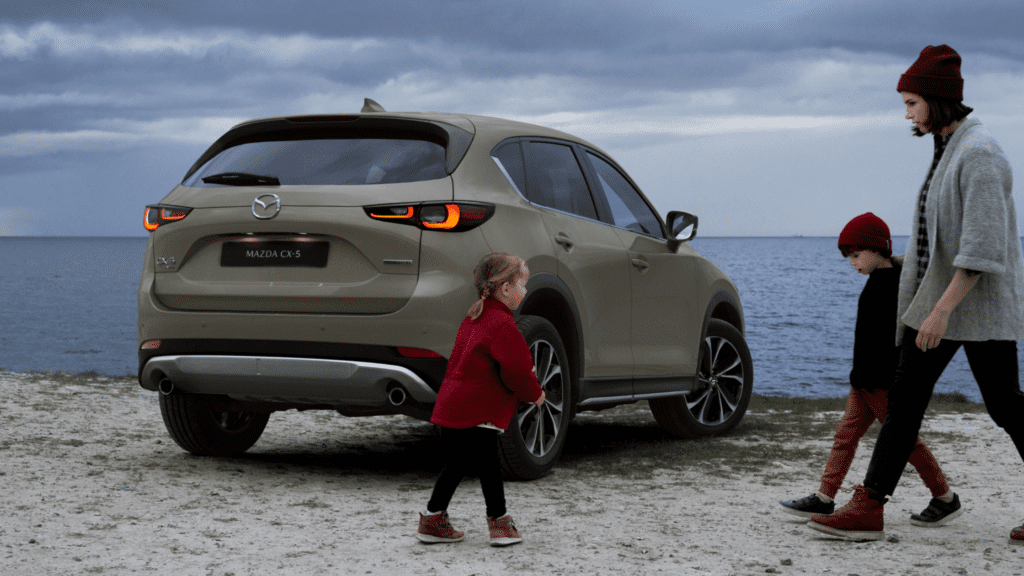 What makes the 2022 CX 5 Mazda family car ideal for travel?
