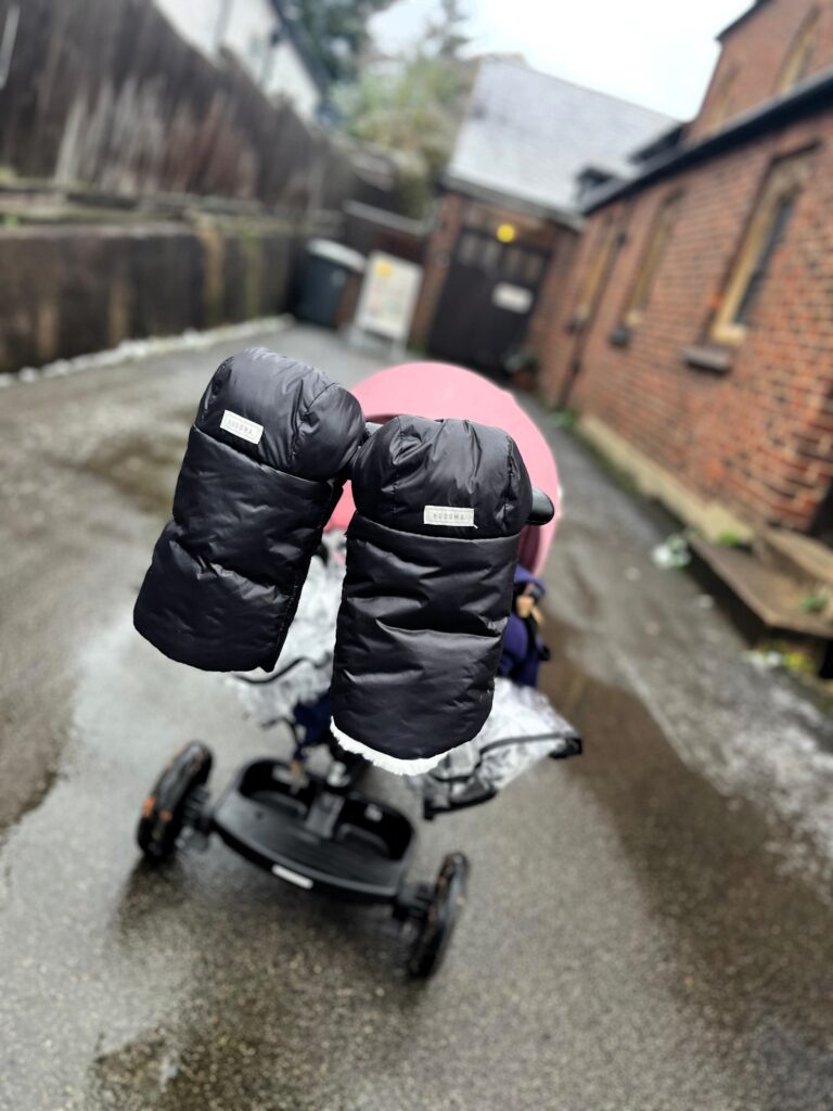 “Effortlessly attached to the pram handle for convenience and warmth.”
